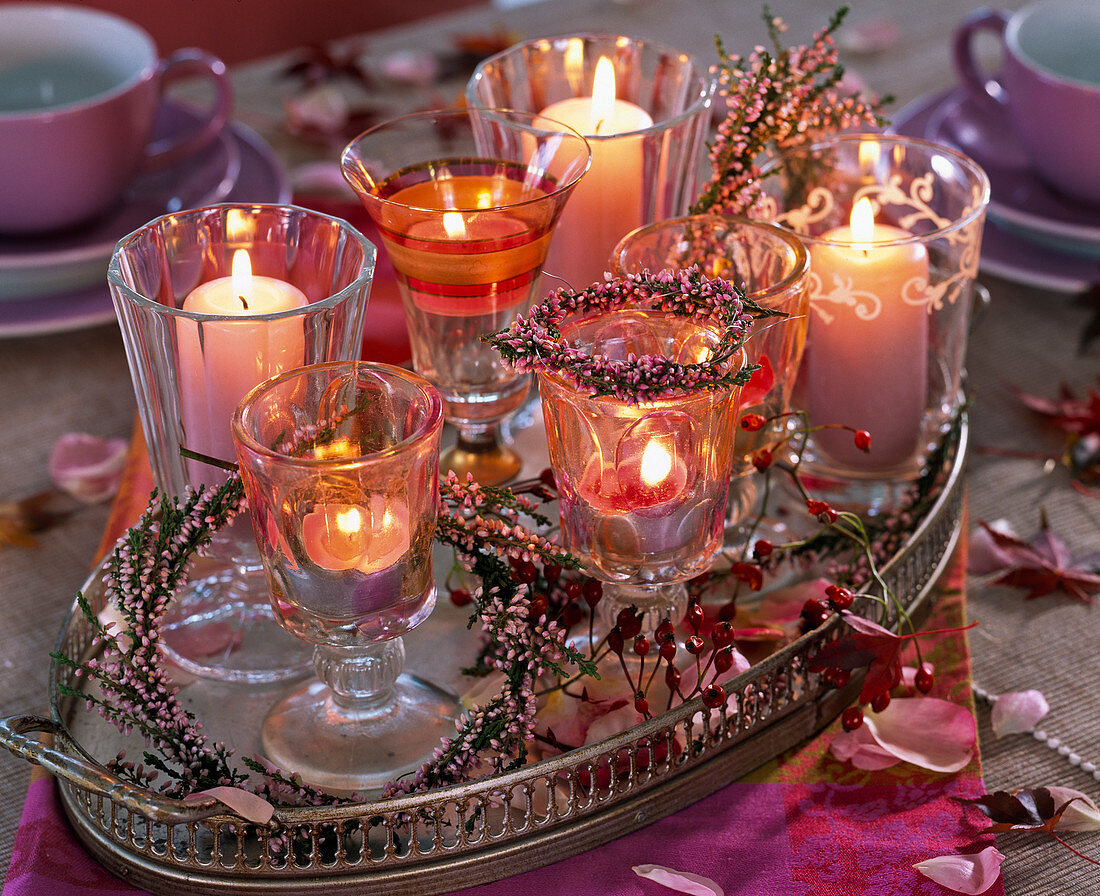 Lanterns with wreaths of calluna (broom heather) and rose hips