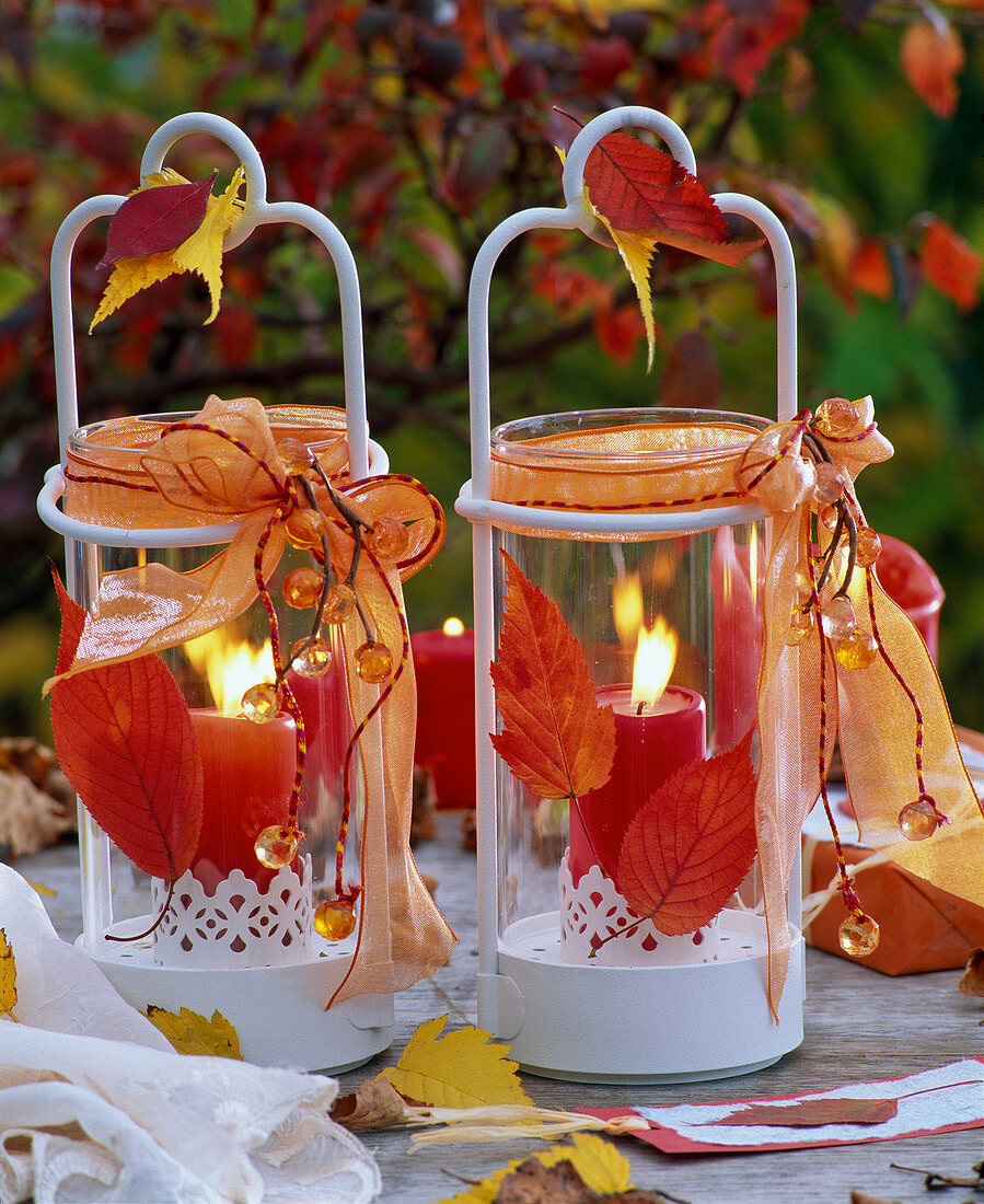 Lanterns with autumn leaves, bows and beads