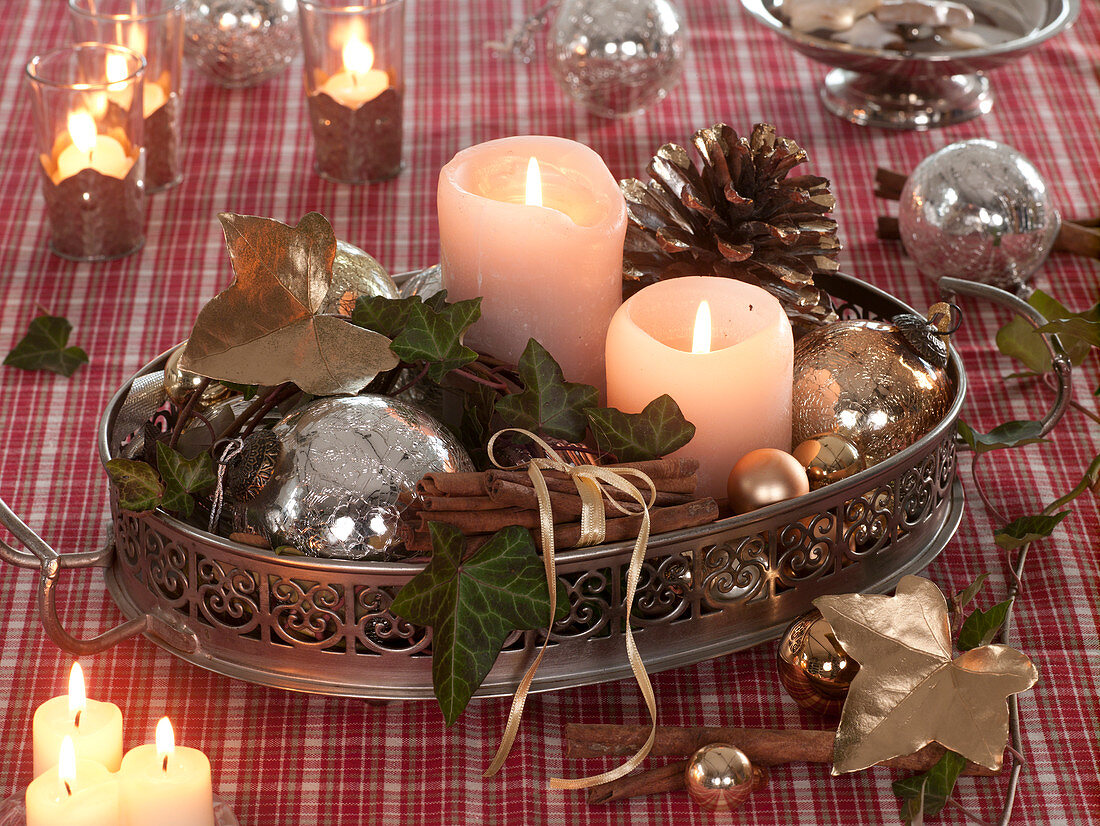Metal tray with candles, Christmas tree balls, cinnamon sticks
