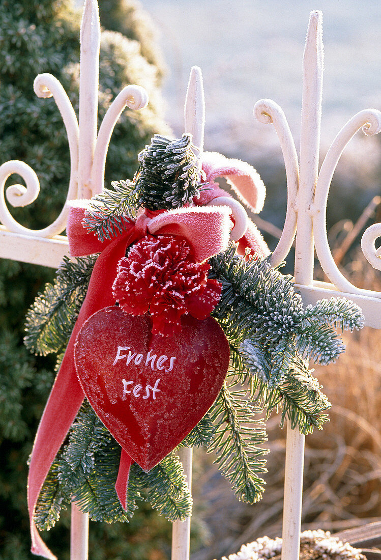 A bouquet of abies, dianthus, heart with message