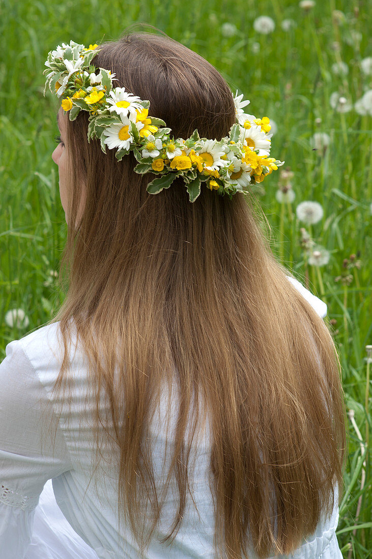Woman with wreath of Leucanthemum (spring daisies)