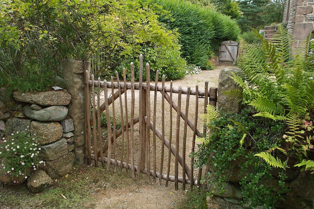 Walnut gate in dry stone wall