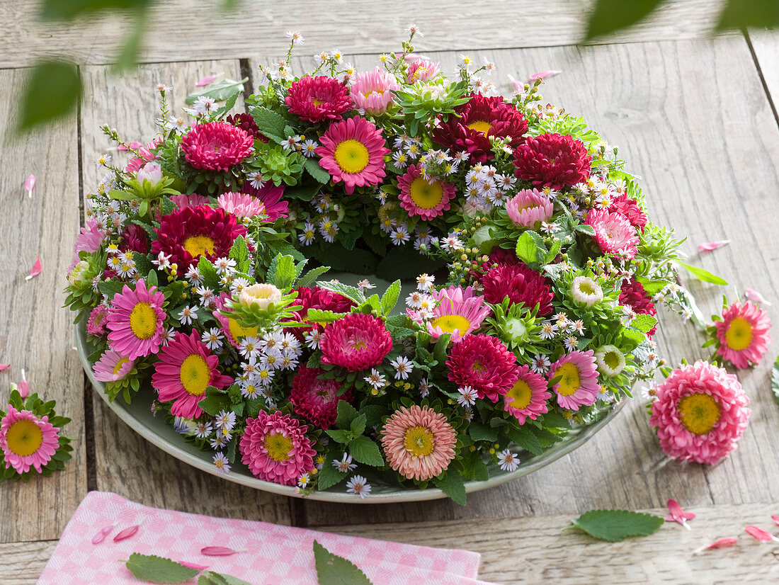 Wreath of summer asters, autumn blackberries and catnip