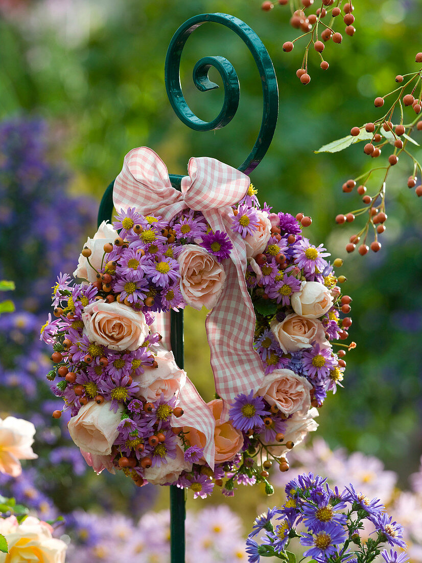 Wreath of pink (roses and rosehips), aster (autumn asters)