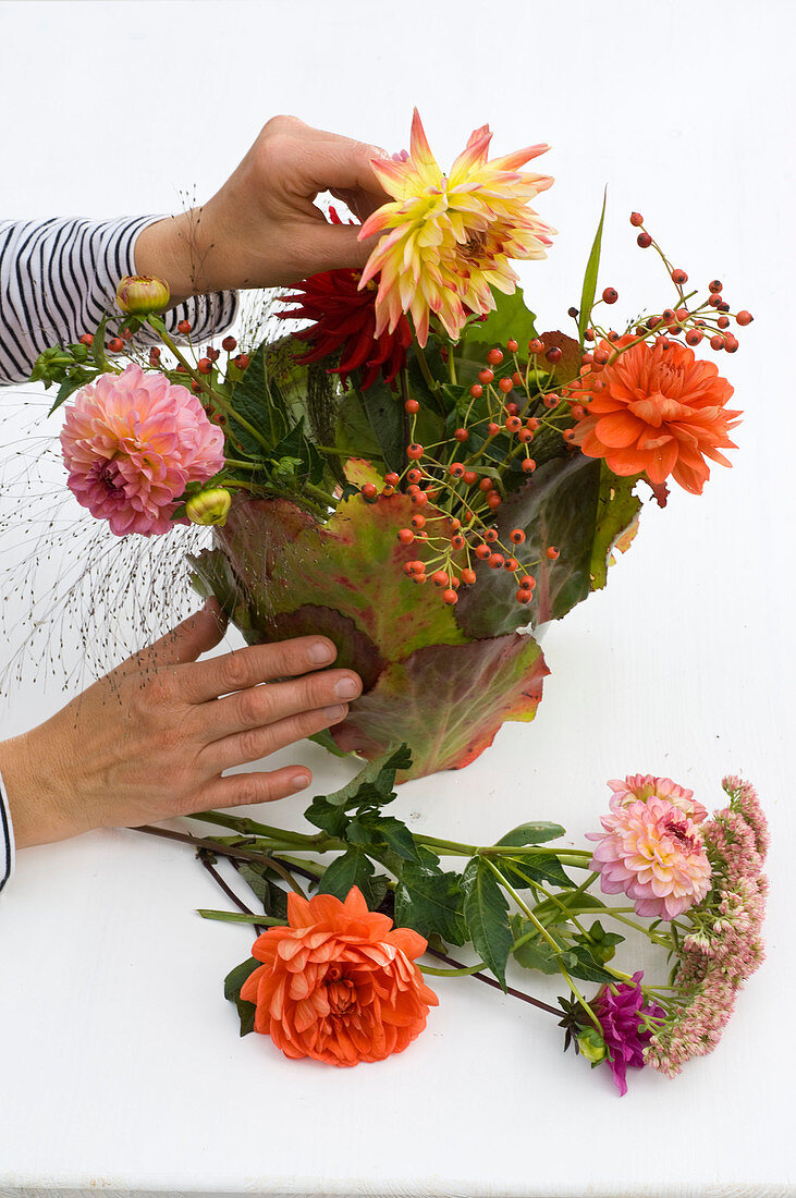 Dahlia bouquet in foliage vase 5/6