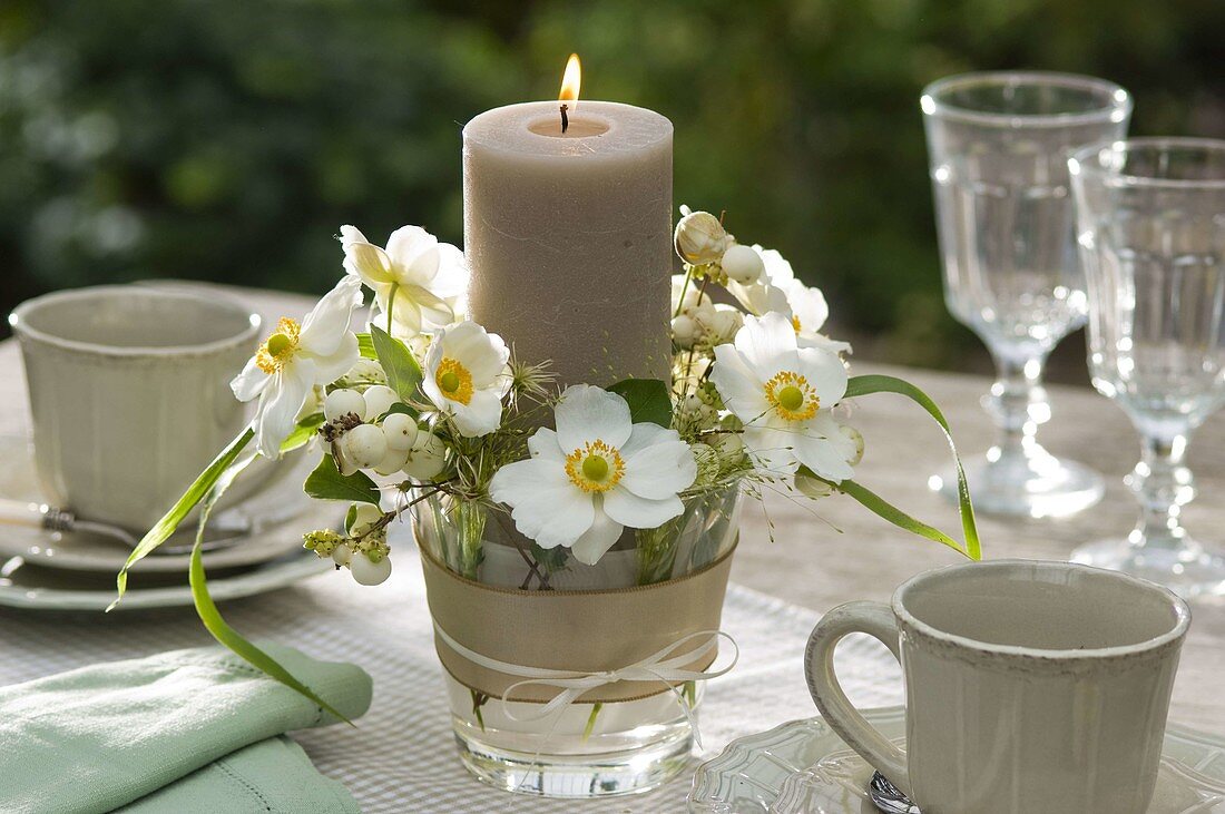 Candle with anemone japonica (autumn anemone)