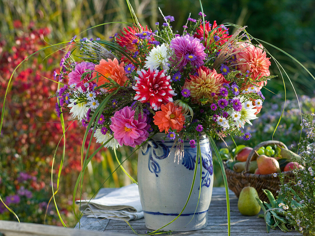 Autumn bouquet with dahlia, aster, miscanthus