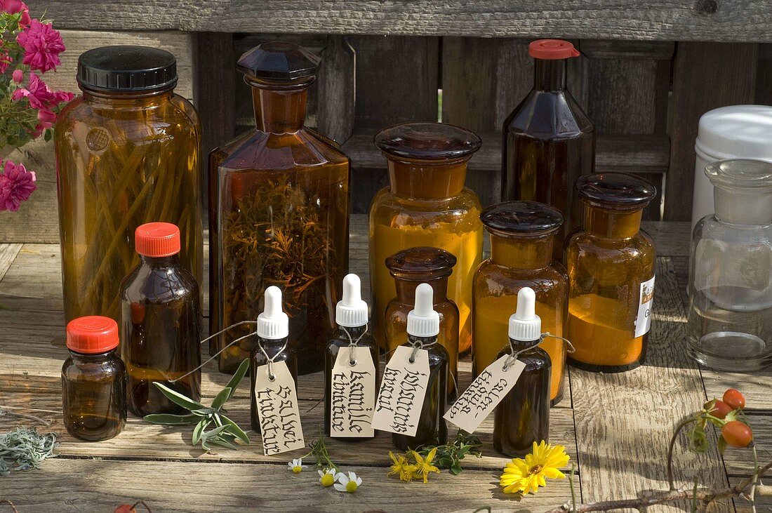 Ingredients for the herbal pharmacy in jars and bottles