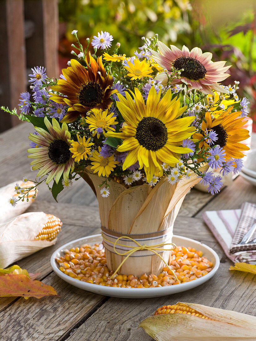 Autumn bouquet of Helianthus 'Autumn Beauty' (sunflowers), Aster
