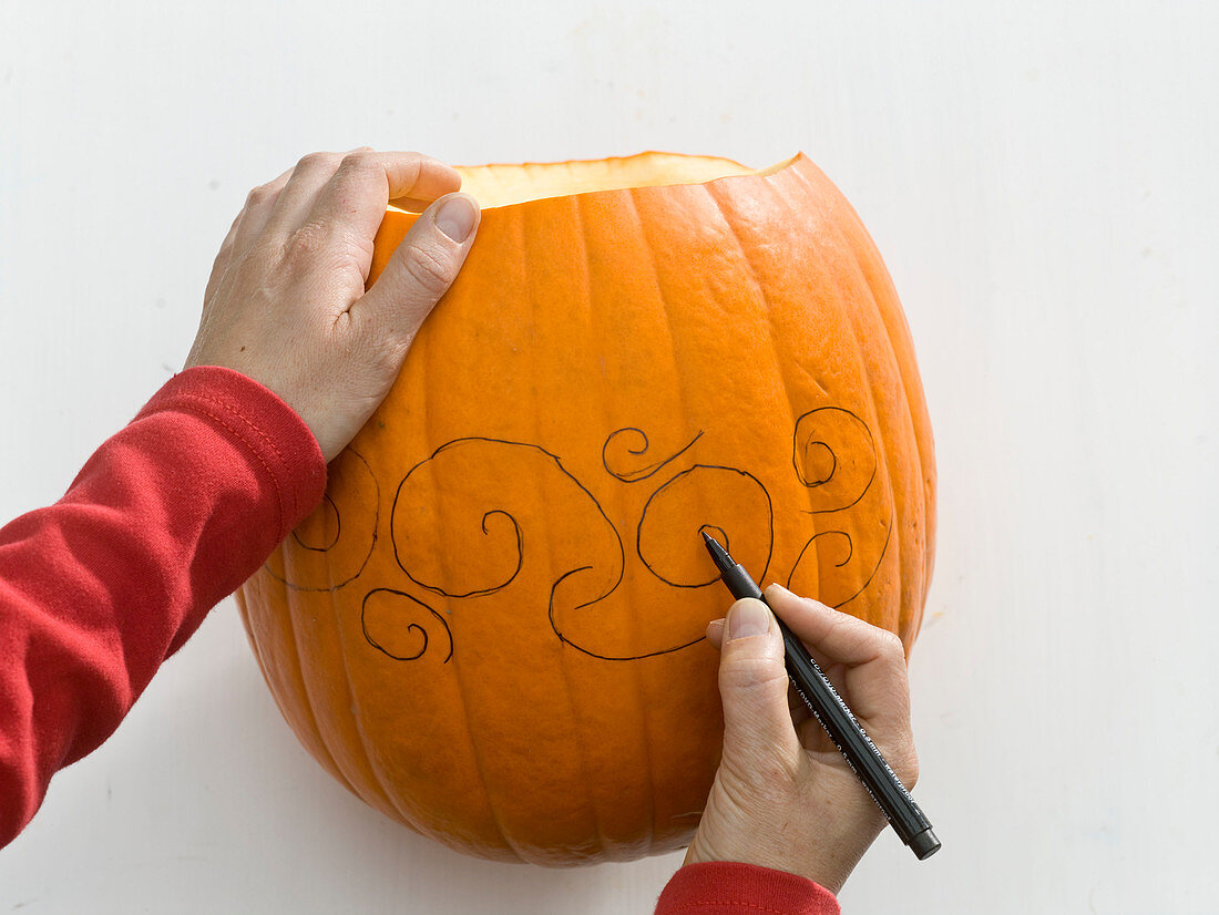 Carved pumpkin as a candleholder and as a vase