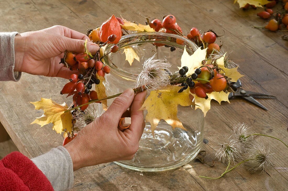 Lantern with rosehips and lampion flowers