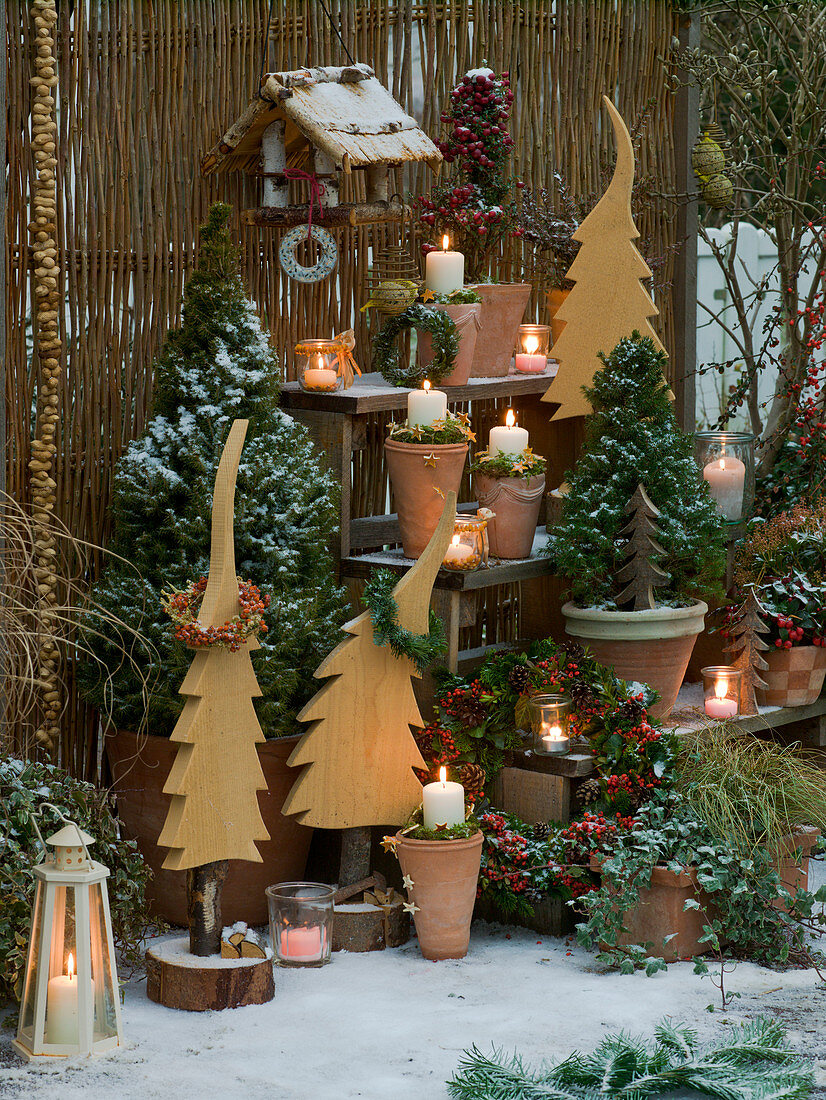 Christmas terrace with staircase and wooden trees