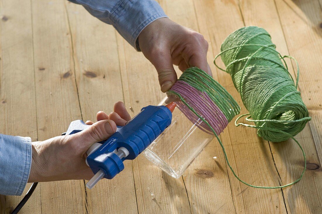 Vases covered with decorative cord and pussy willow