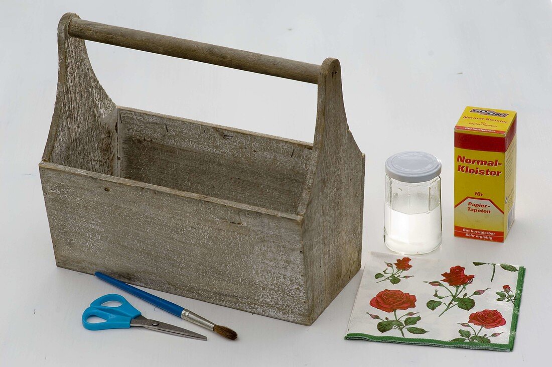 Roses in wooden carrier with napkin technique