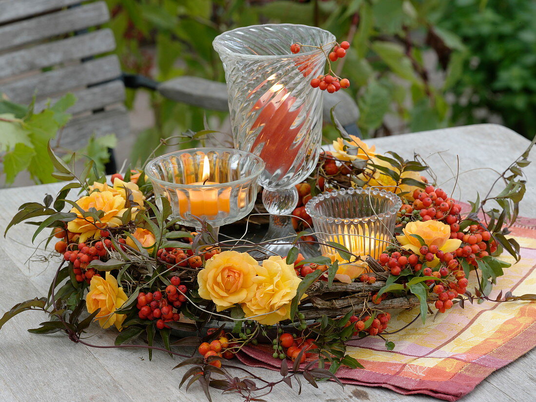 Wreath of Rosa 'Tequila' (roses), Sorbus aucuparia (rowan berries)