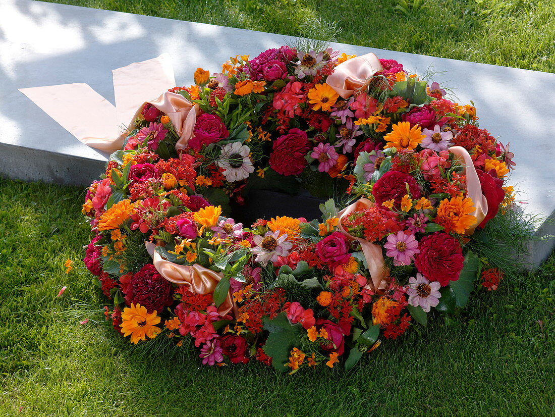 Late summer wreath: Rosa (roses), Zinnia (zinnias), Calendula
