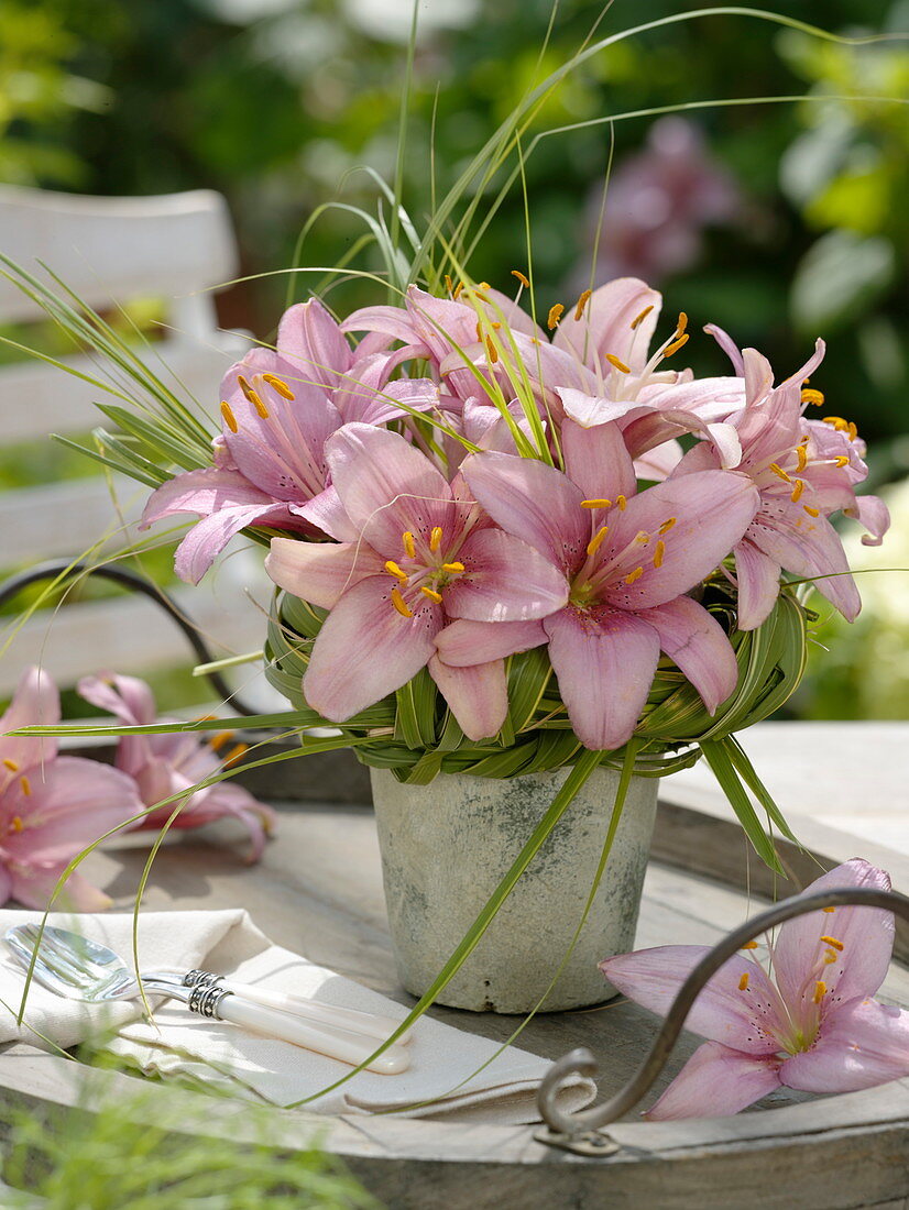 Small lilies bouquet with grass cuff