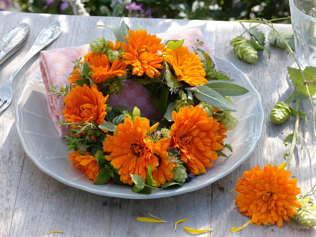 Small wreath out of marigolds and herbs