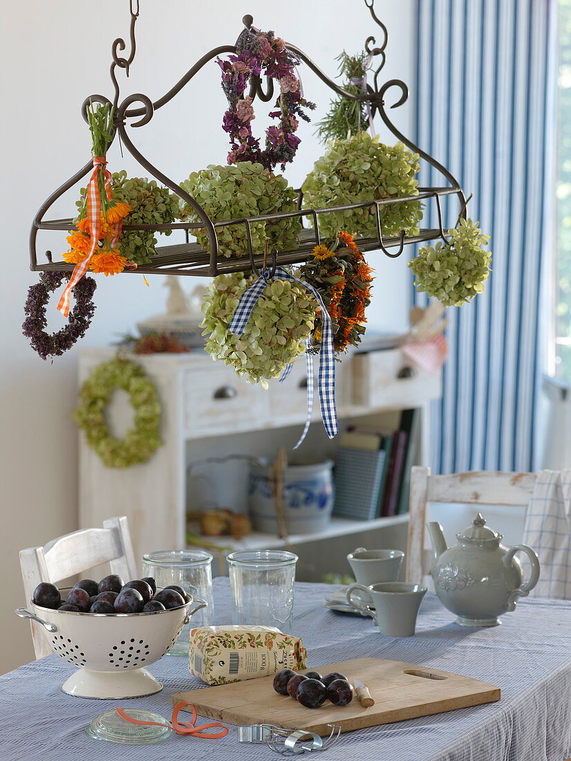 Blossoms and wreaths to dry in and on a metal rack