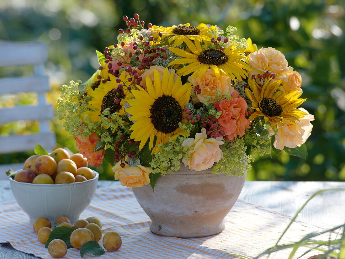 Late summer bouquet with sunflowers and roses