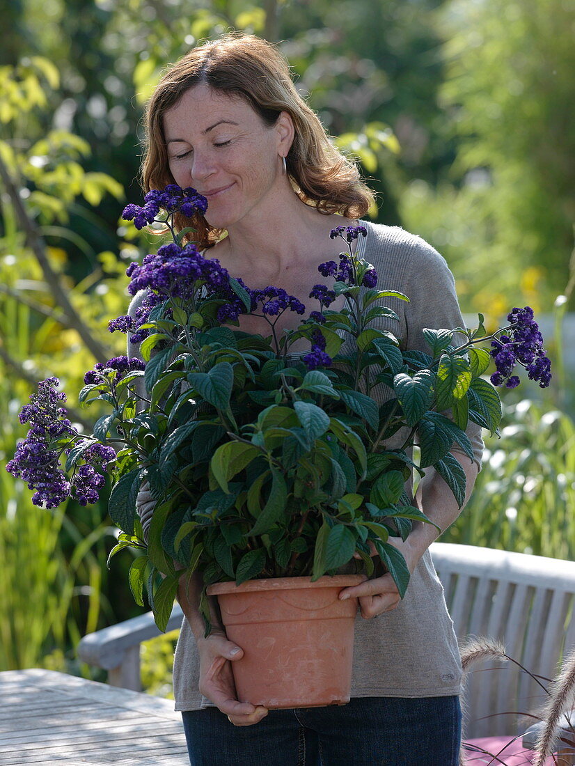 Woman with vanilla flower in tub