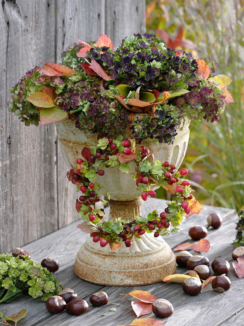 Autumnal iron goblet with hydrangea blossoms
