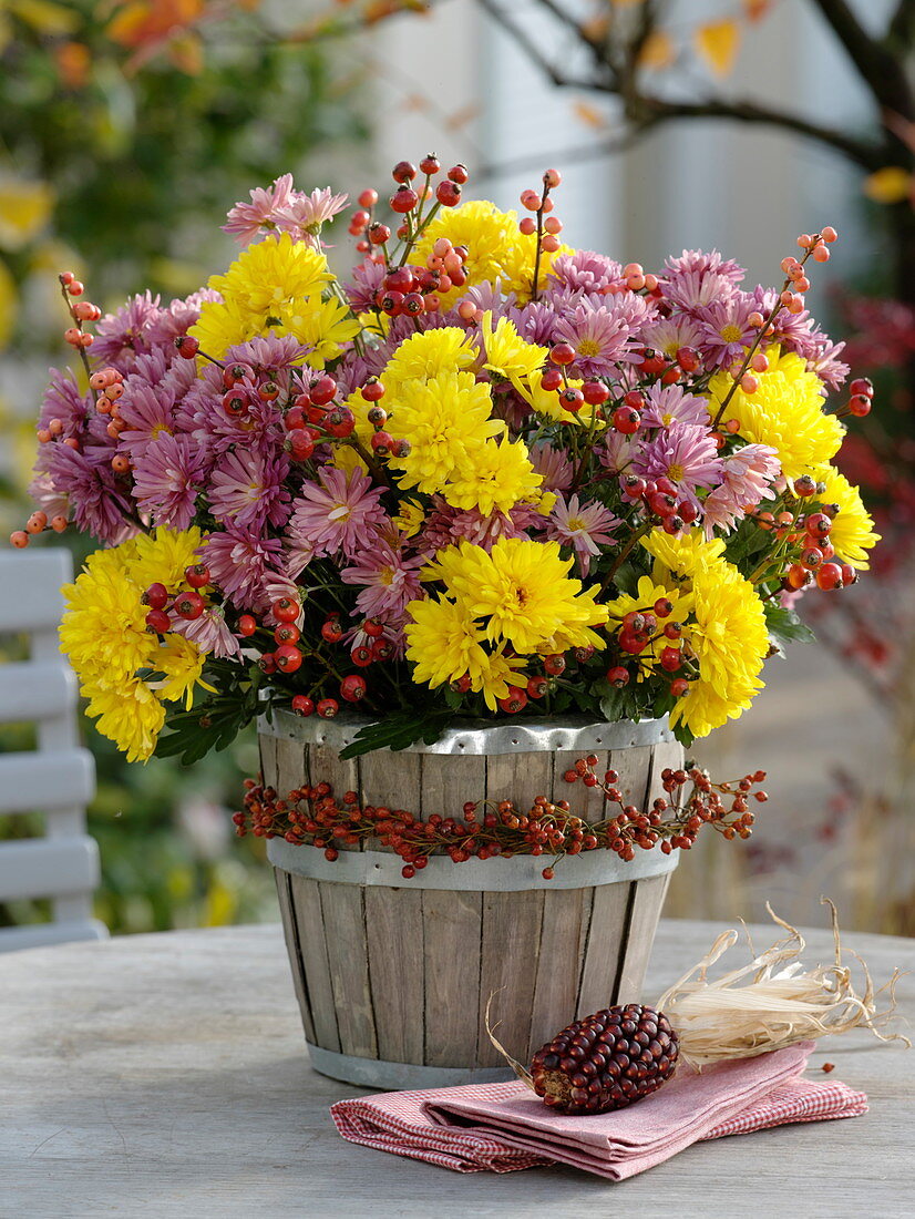 Autumn bouquet of chrysanthemum and rosehips