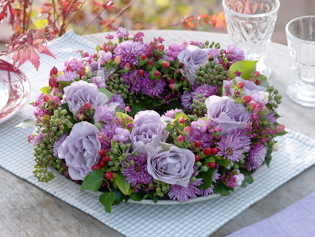 Autumn wreath with violet Rose, aster, hedera