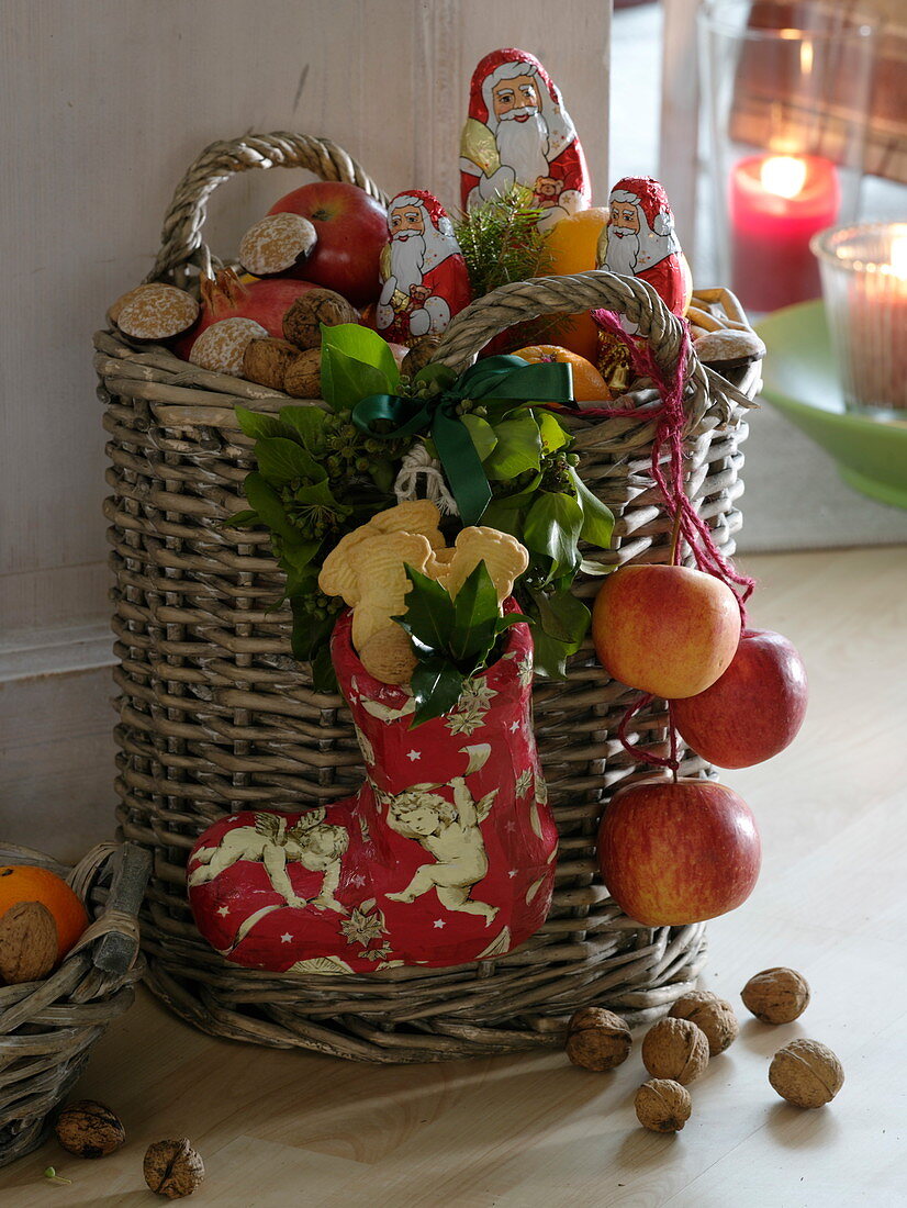 St. Nicholas presents, basket filled with apples (Malus), oranges