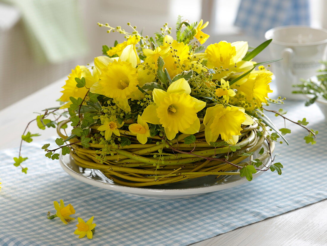 Yellow daffodil bouquet in wreath of dogwood branches