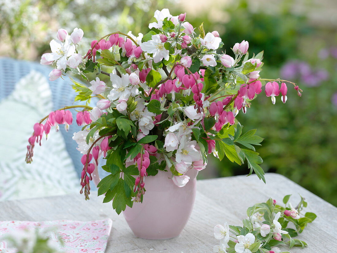 Delicate spring bouquet with Dicentra and Malus 'Evereste'