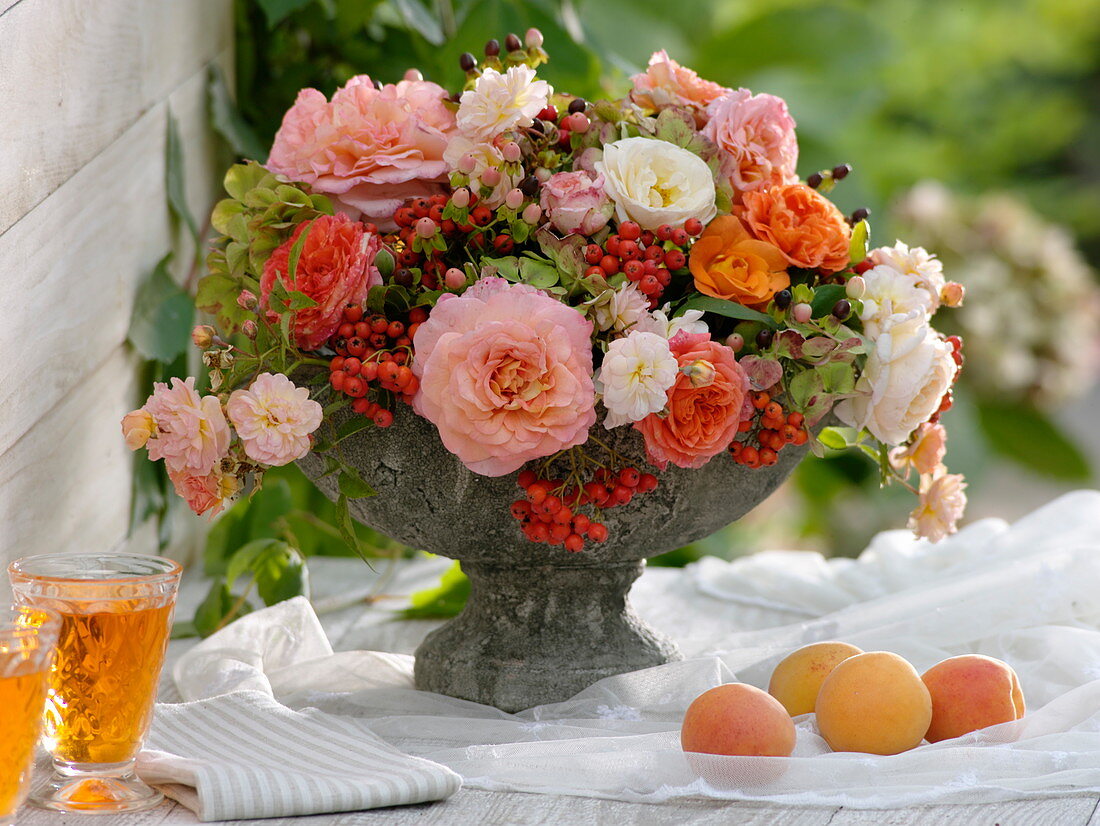 Arrangement in grey bowl with foot