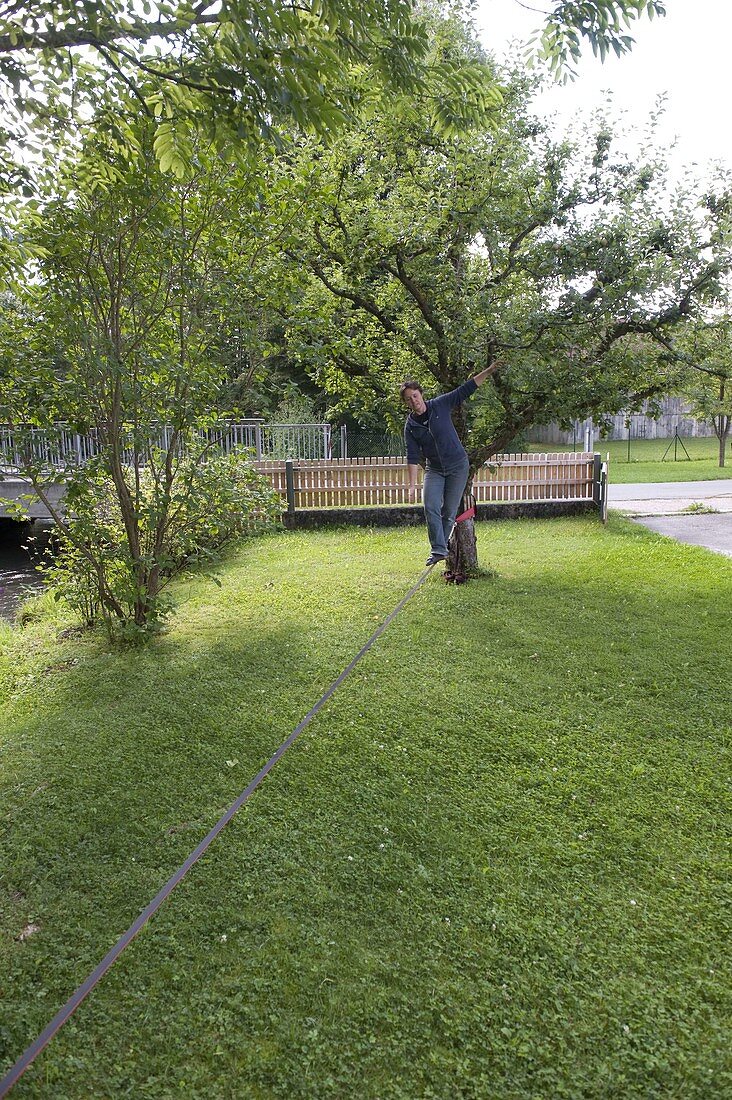 Woman balancing on slackline