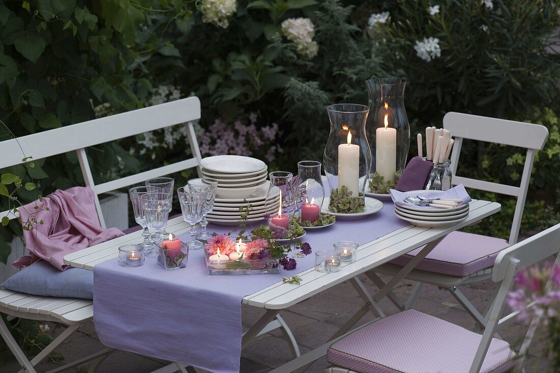 Evening terrace: table decoration with lanterns, Dahlia (Dahlias)