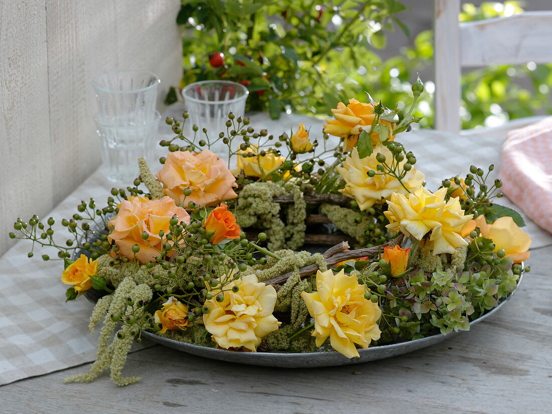 Wreath of pink 'Tequila' (roses, rose hips), Amaranthus (foxtail)