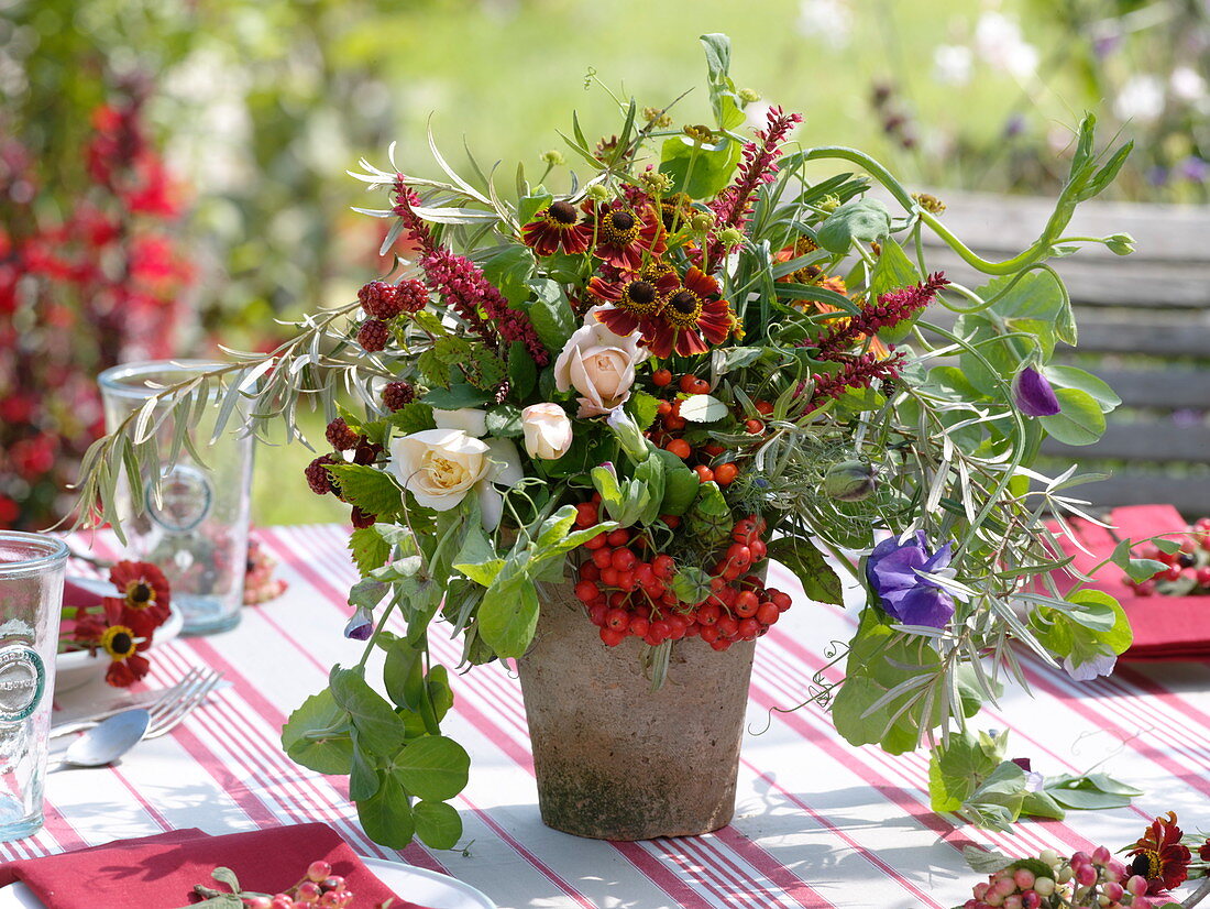 Late summer bouquet with Rosa (roses), Lathyrus odoratus (sweet pea)