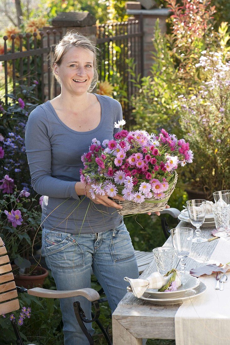 Autumn table decoration with asters and pears