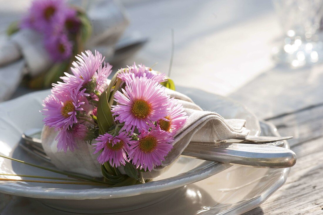 Autumn table decoration with asters and pears