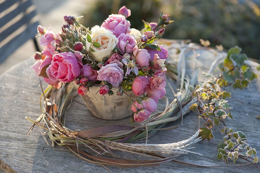 Frozen pink (rose) in grasses wreath