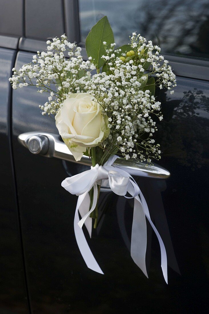 Bridal car with mini bouquet on door handle