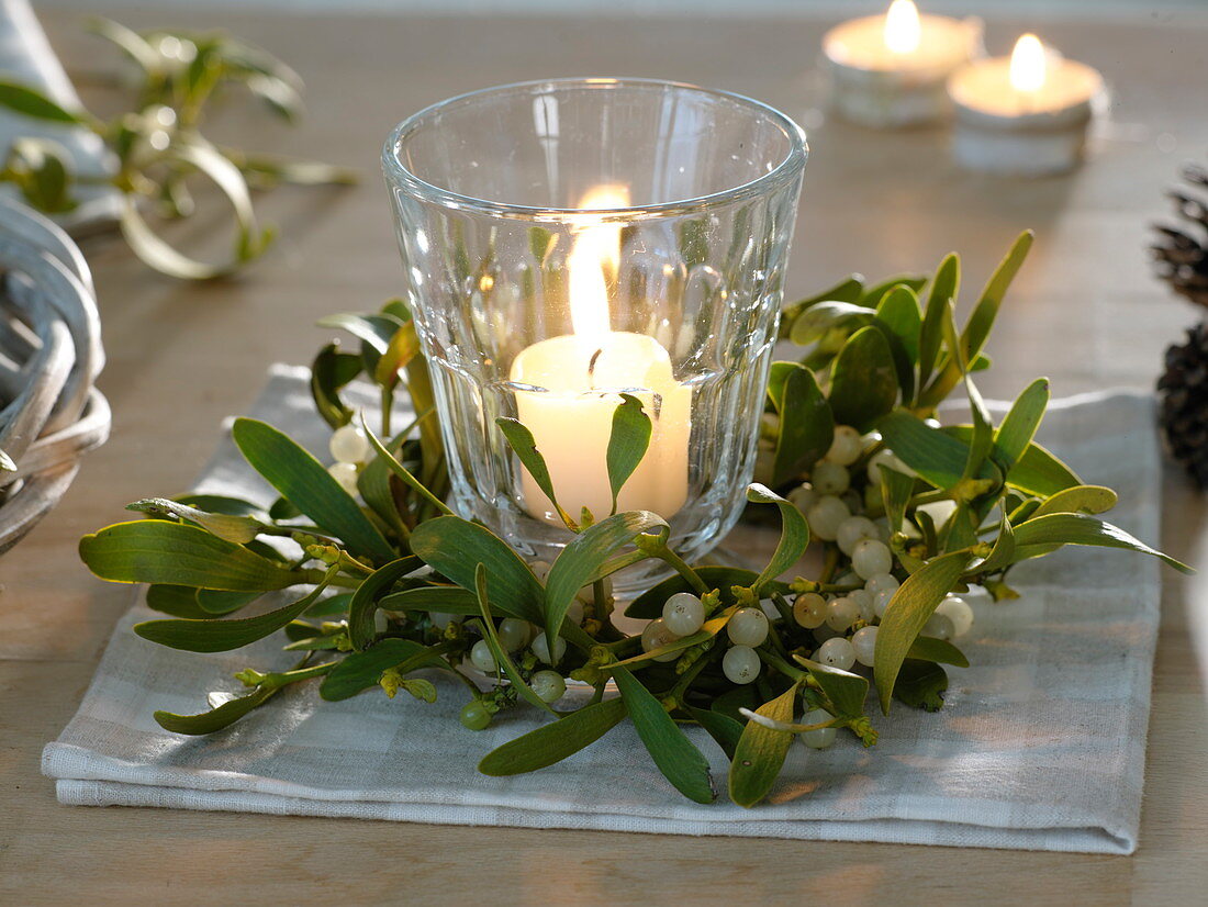 Lantern in a small wreath of Viscum album (mistletoe) branches