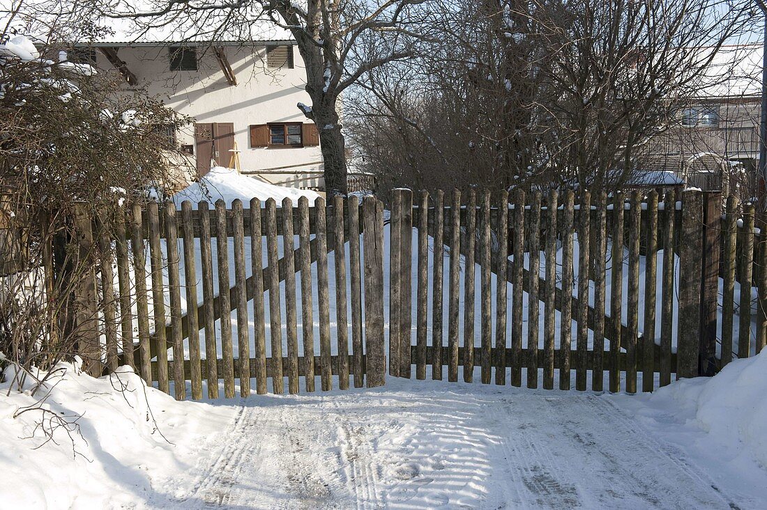 Old wooden gate as courtyard entrance