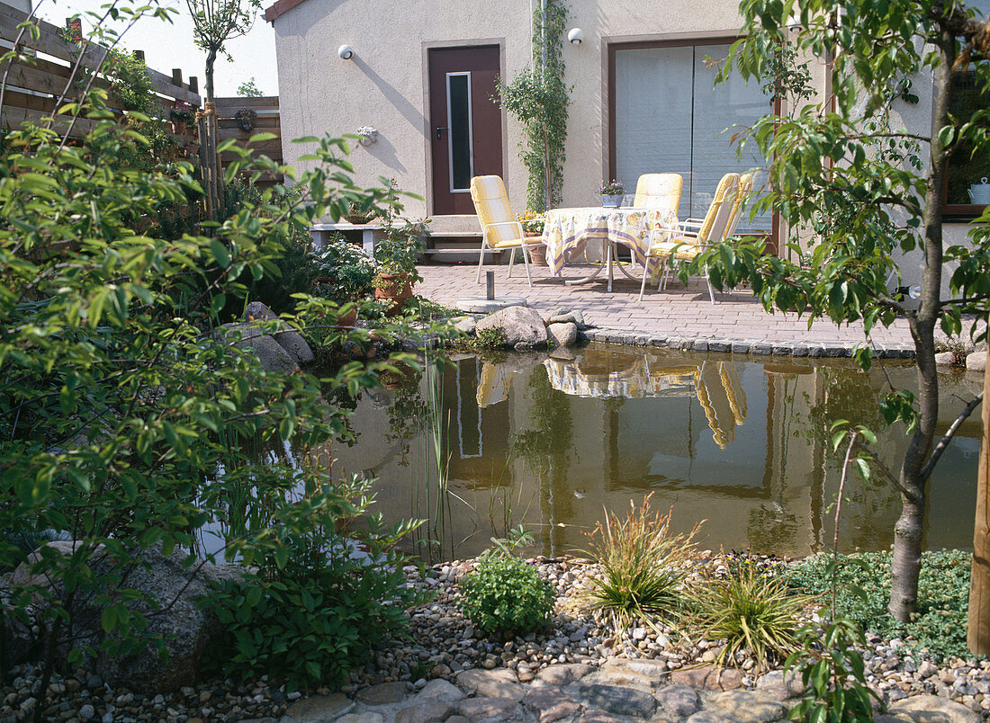 Garden view with terrace and pond