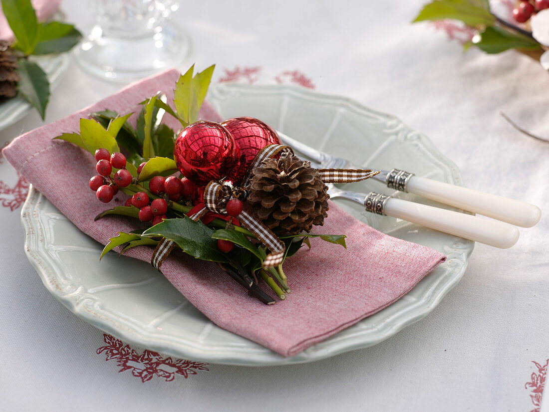 Small bouquet of Ilex (Holly), cones and red balls