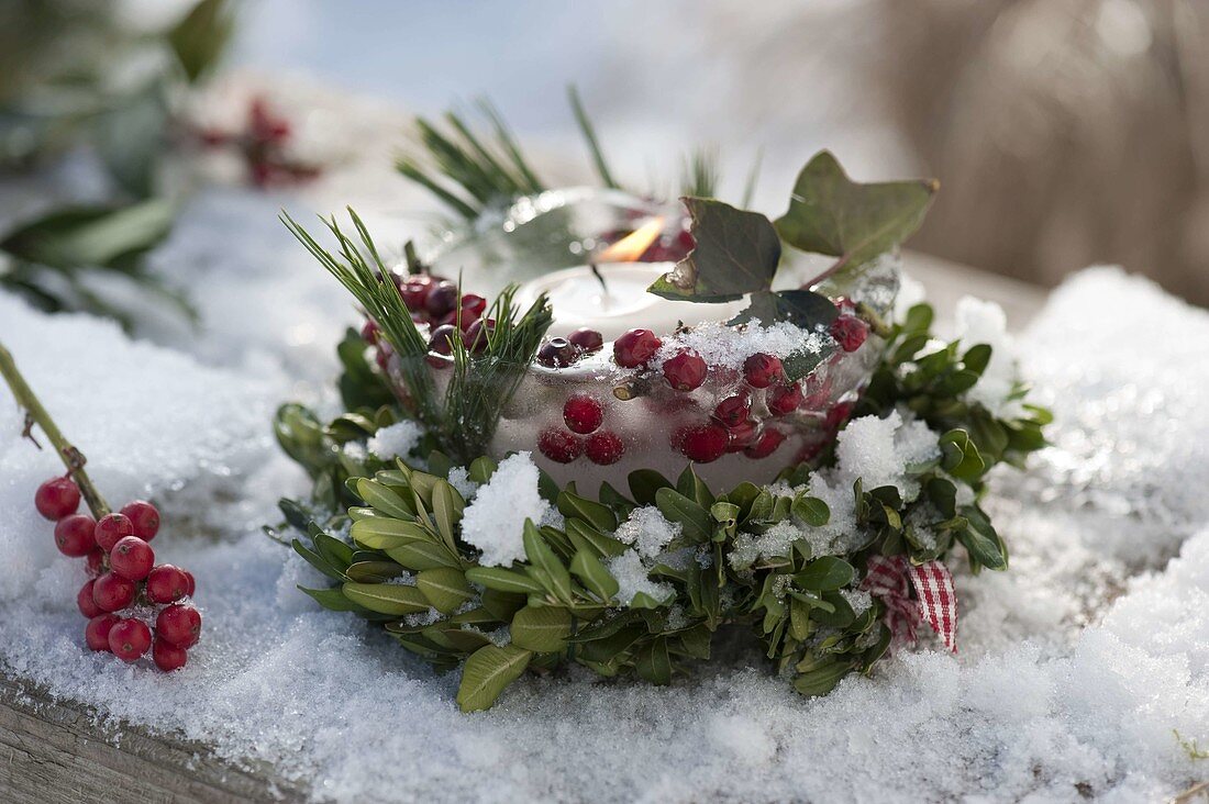 Homemade ice lantern in box wreath