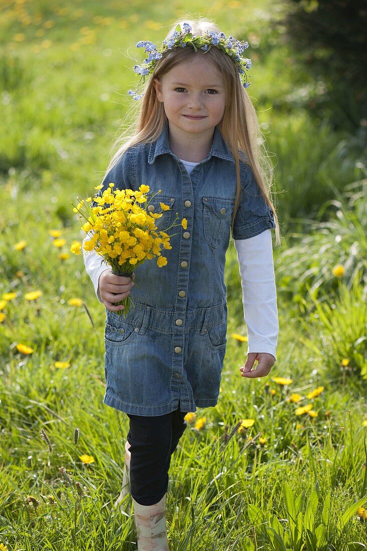 Girl with bouquet of buttercups