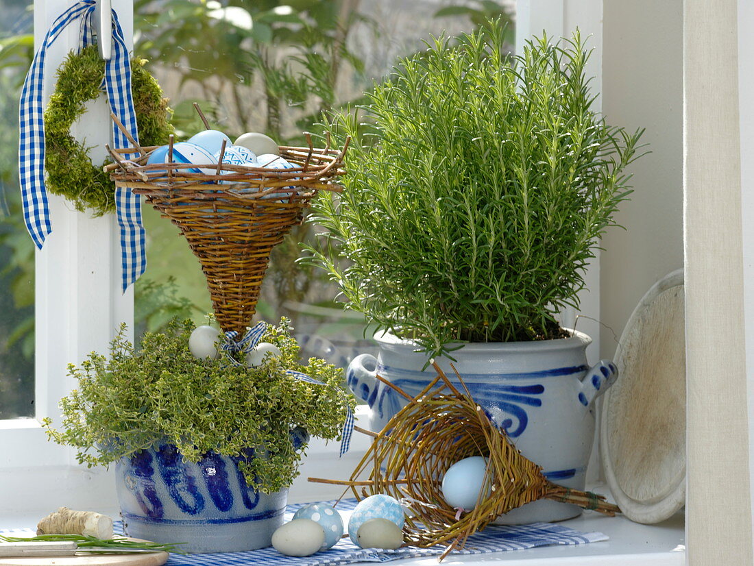 Herbs in window decorated for Easter