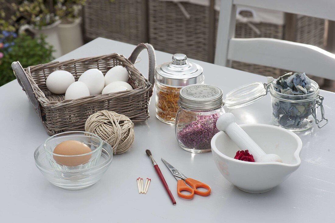 Sticking crushed flowers to easter eggs