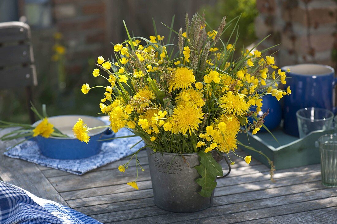 Yellow meadow bouquet and wreath of Taraxacum (dandelion), Ranunculus