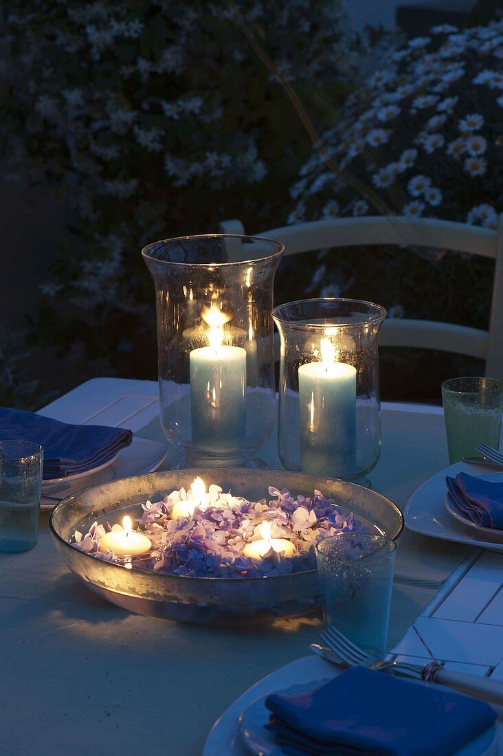 Lanterns with candles and bowl with hydrangea (hydrangea flowers)